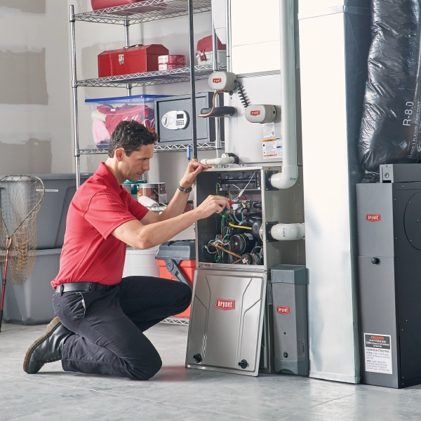 bryant tech installing heating unit on basement